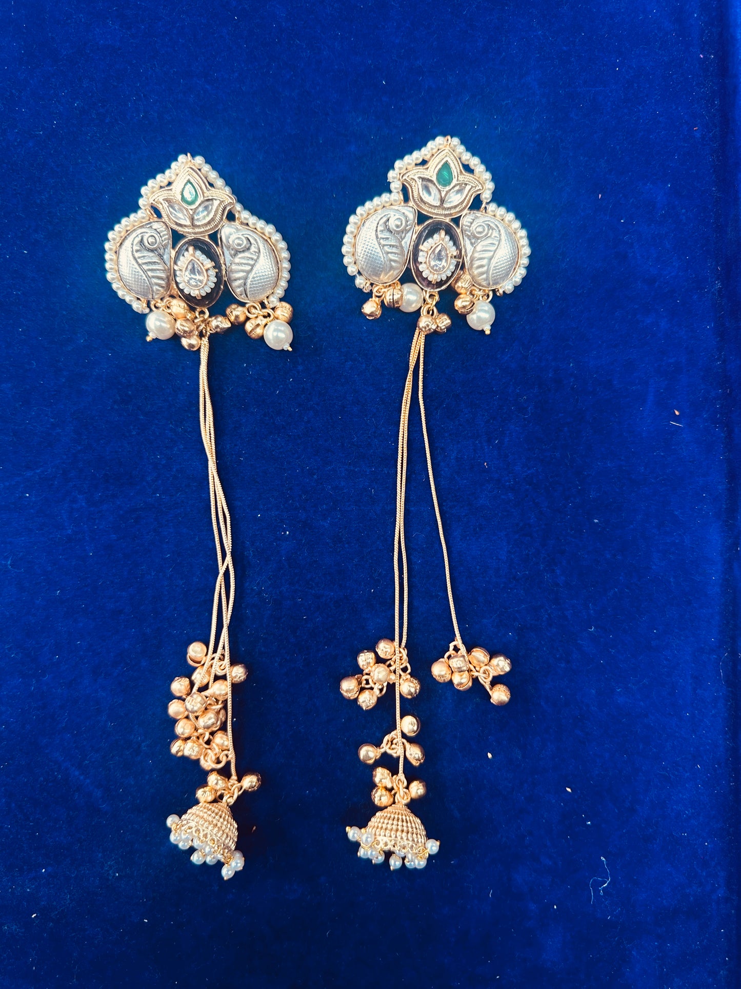 Traditional Indian Kundan Peacock Jhumka Earrings with Long Gold Chains and Pearls.
