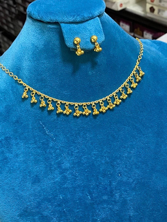 Golden necklace tanmaniya